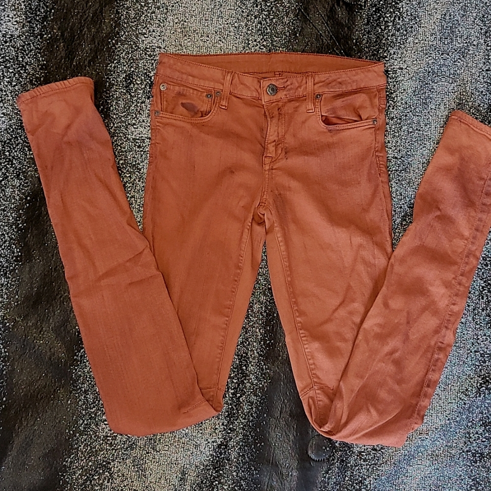Helmut Lang rust orange/red jeans w/burnt splatter detail